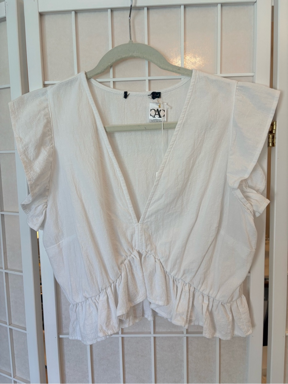 Fancyinn White Ruffle-Hem V-Neck Crop Top